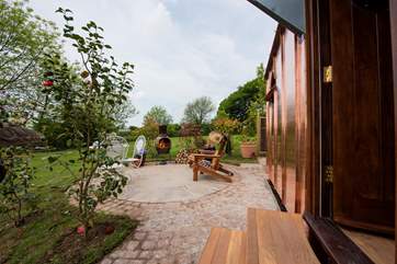 There is a lovely patio area, complete with chiminea, for sitting out and enjoying a sunny evening.