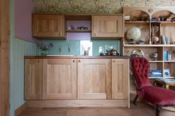 There is a well-equipped kitchen area, complete with kettle and two-ring gas hob.