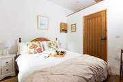 The comfortable bedroom has an en suite.