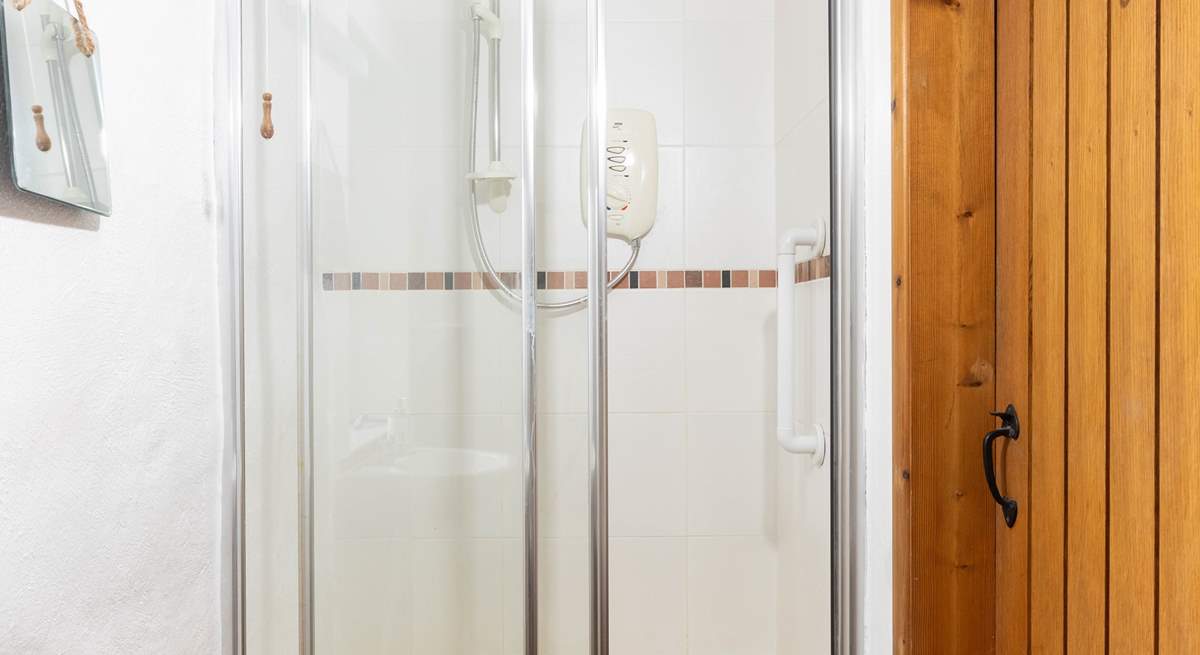 The step into the en suite shower is approx thirteen inches.