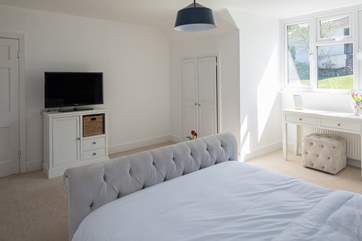 Another angle of bedroom 3, showing a glimpse of the lovely view over the garden.