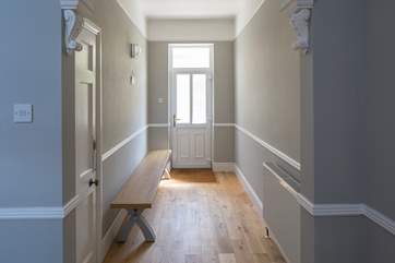 The entrance hall is equipped with a bench to help you kick off your shoes and hang your coats up (hooks will be in place) after a full day of fun.