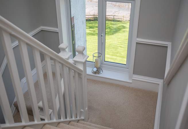 The 2-tiered staircase wind up to the first floor, offering wonderful views on the way.