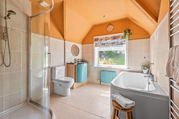 The swish family bathroom has a bath and separate shower cubicle.
