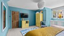 Catch up on the morning news on the Smart TV in bedroom 3.