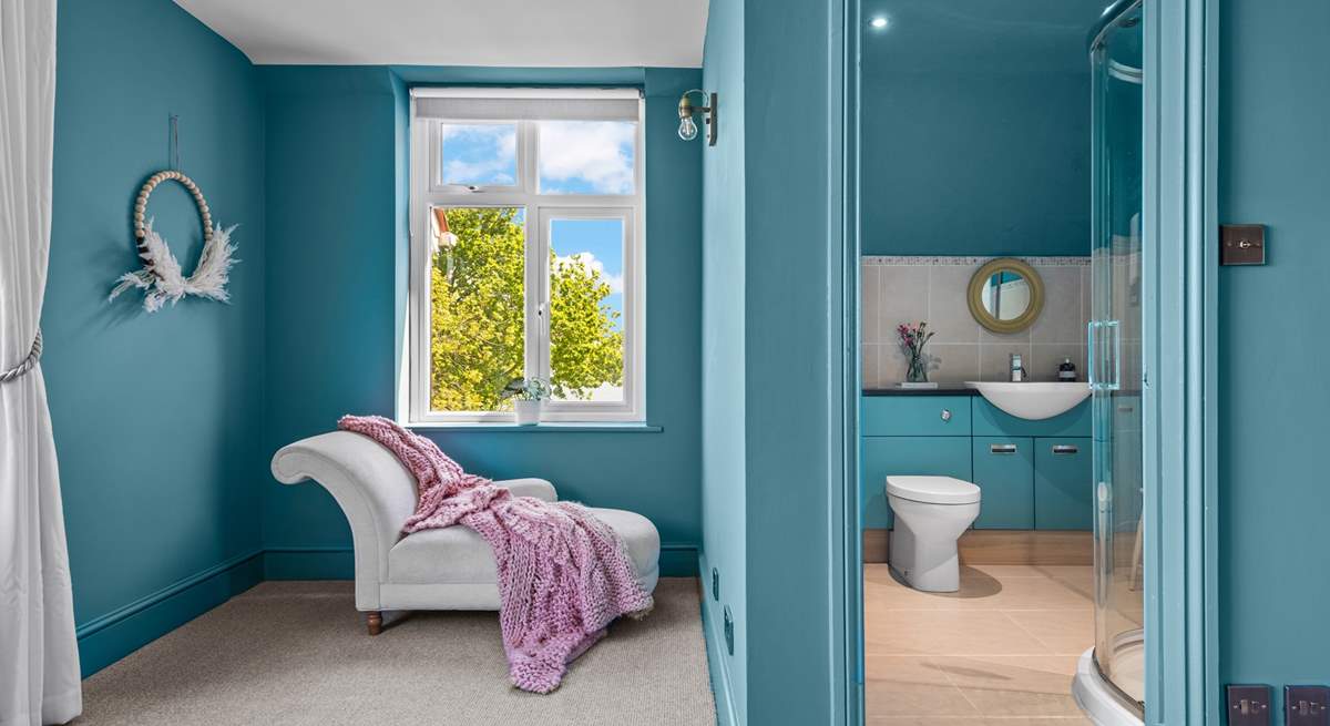 Bedroom 2 has a stylish en suite shower-room, and a chaise longue for quiet moments.