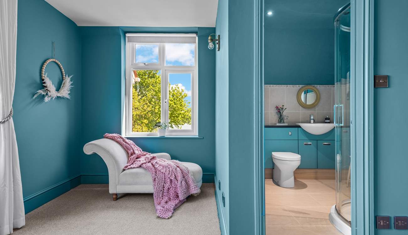 Bedroom 2 has a stylish en suite shower-room, and a chaise longue for quiet moments.