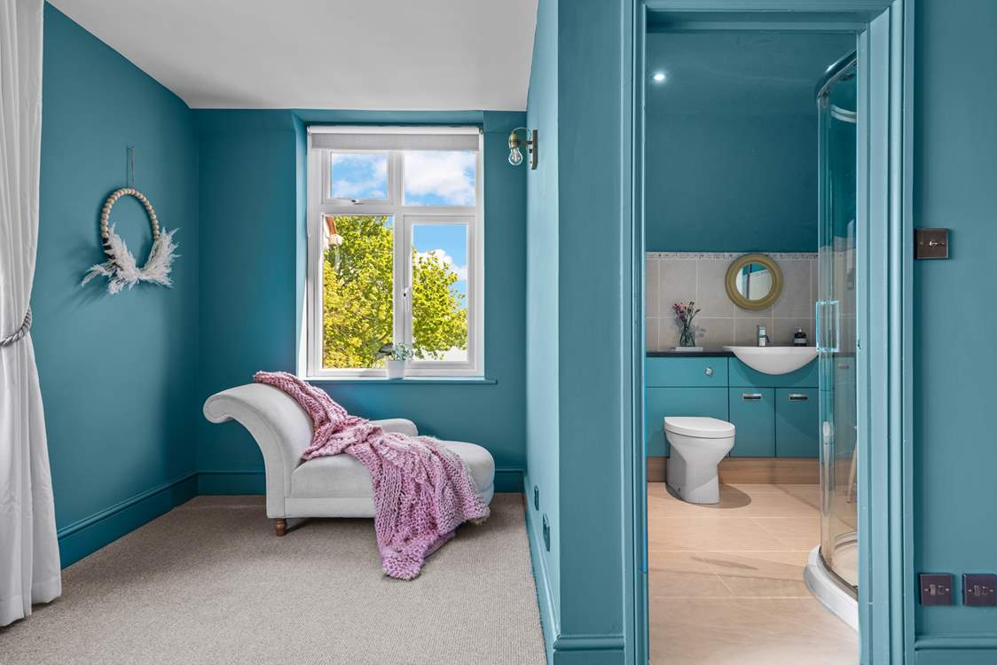 Bedroom 2 has a stylish en suite shower-room, and a chaise longue for quiet moments.