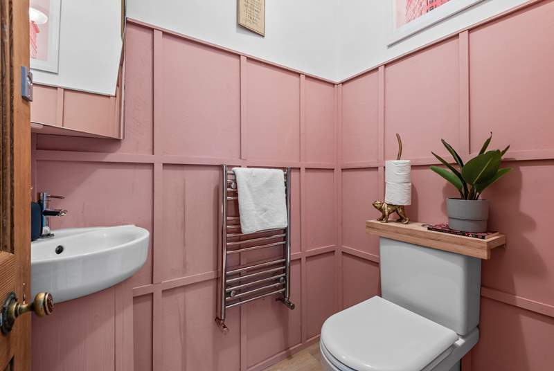 The ground floor cloakroom is pretty in pink!