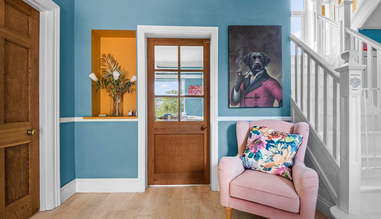 Quirky artwork marries beautifully with the vibrant colour scheme here.