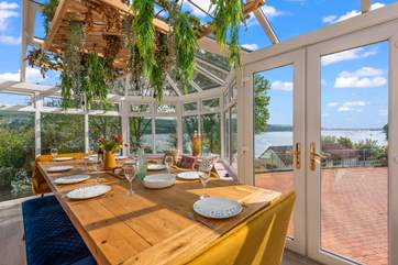 The dining table has a stunning view towards Shaldon and Teignmouth.