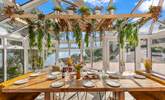 Enjoy sociable dining with a stunning waterside view. - Thumbnail Image