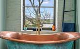 Now this is what I call a bath tub with a view! This is the luxurious bathroom in Meadowcliff Cottage. - Thumbnail Image