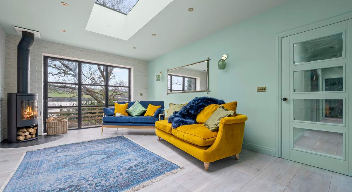 The sitting-room leads into the hallway where the three beautiful bedrooms and bathrooms can be found.