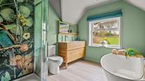 The swish family bathroom has a bath and separate shower cubicle.