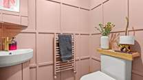 The ground floor cloakroom is pretty in pink!