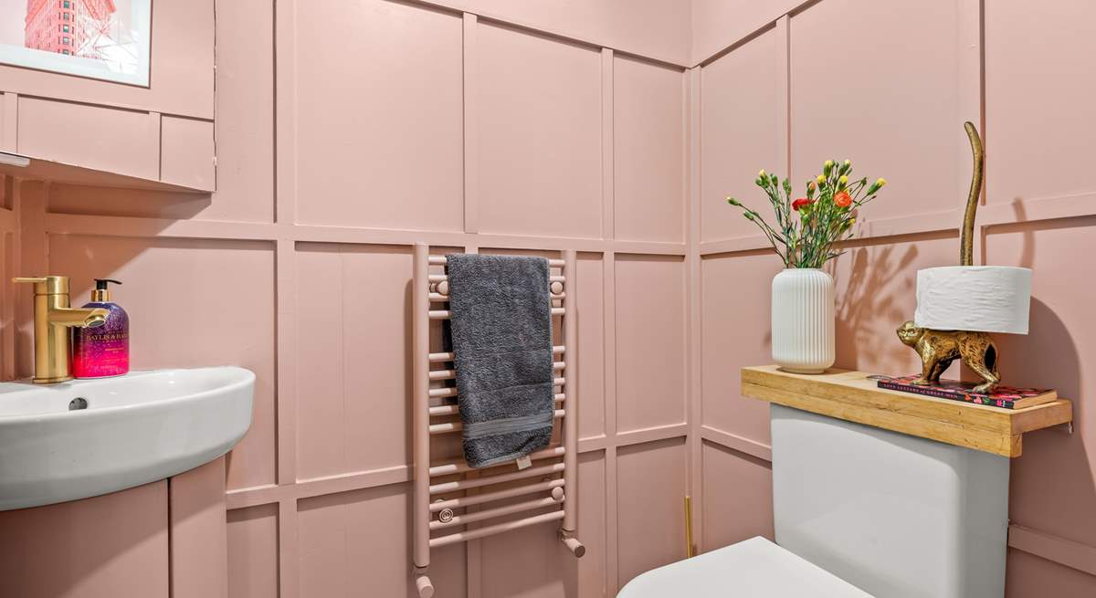 The ground floor cloakroom is pretty in pink!