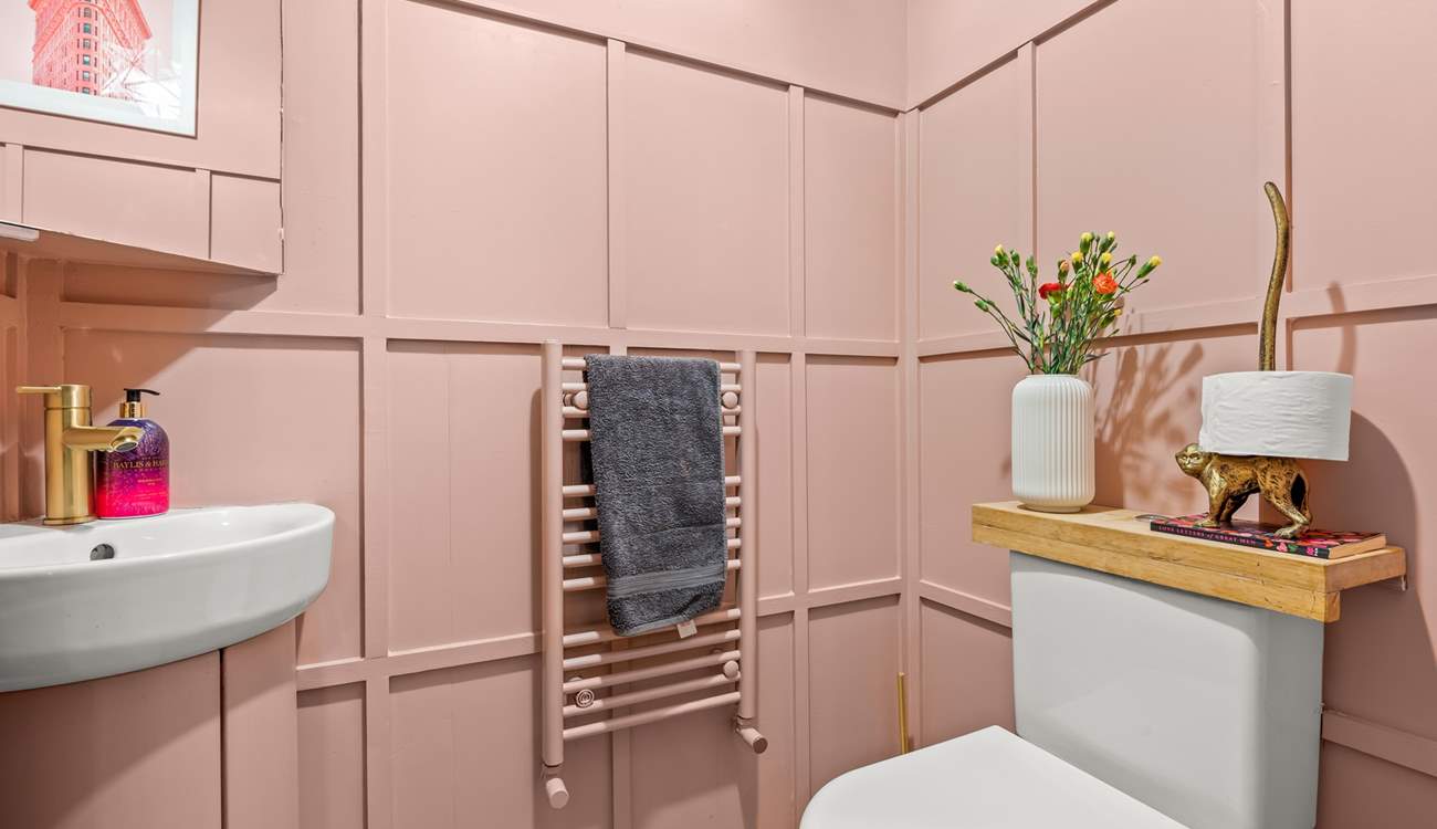 The ground floor cloakroom is pretty in pink!