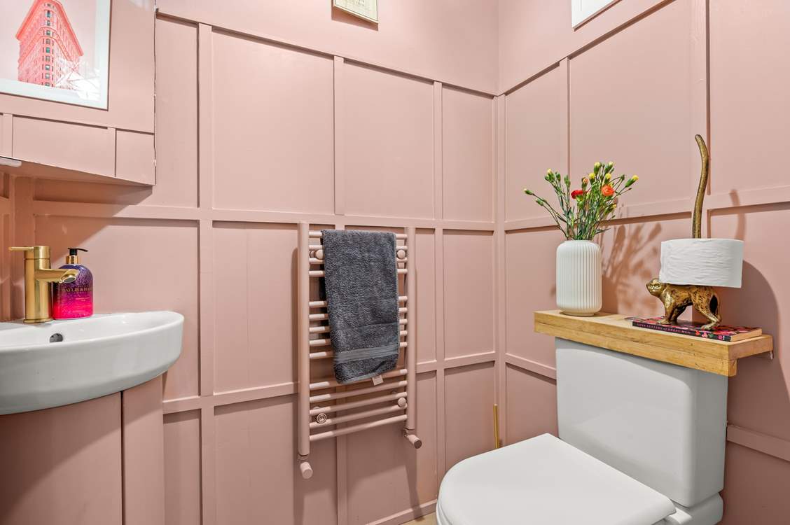 The ground floor cloakroom is pretty in pink!