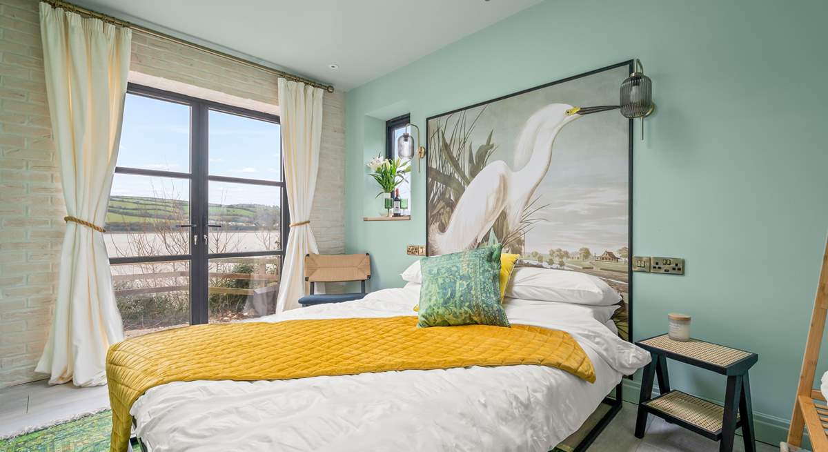 All bedrooms have stunning waterside views, even on a gloomy winters day. This is en suite Bedroom 8 in Meadowcliff Cottage