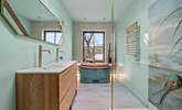 The luxury bathroom is home to a glorious copper roll-top bath and glorious shower cubicle. - Thumbnail Image