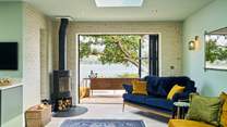 Snuggling up in front of the wood-burner, enjoying such fabulous waterside views is simply glorious.