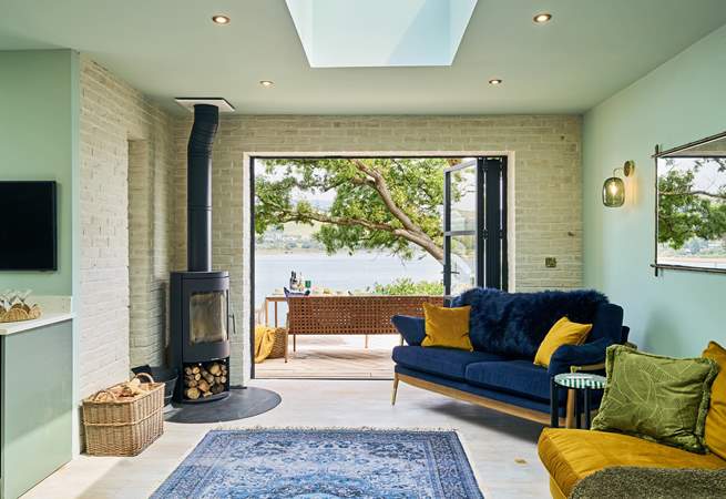 Snuggling up in front of the wood-burner, enjoying such fabulous waterside views is simply glorious.