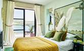 Bedroom 8 is home to this very inviting king-size bed, which is also complimented by an en suite shower-room. - Thumbnail Image