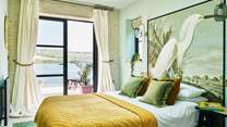 Bedroom 8 is home to this very inviting king-size bed, which is also complimented by an en suite shower-room.
