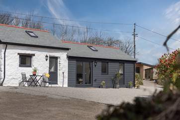 Drive past the front of the barn and park on the gravel where allocated.