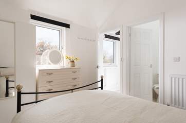 The bedroom is a relaxing oasis in this charming barn.