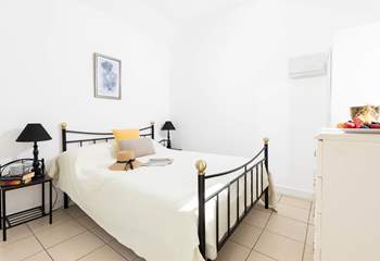 The bedroom is a relaxing oasis in this charming barn.  