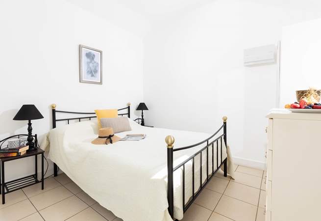 The bedroom is a relaxing oasis in this charming barn.  