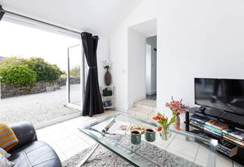 Double doors open to let to cool air breeze through in the summer.  The two steps lead up to the kitchen/diner. 