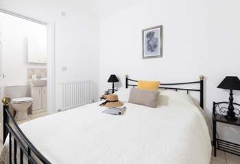 This lovely bedroom has an en suite shower-room. 