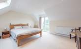 The master bedroom with a super-king size bed and en suite shower-room. - Thumbnail Image