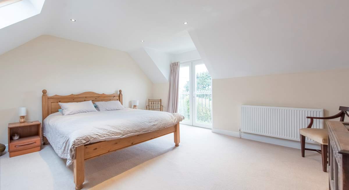 The master bedroom with a super-king size bed and en suite shower-room.