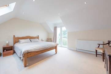 The master bedroom with a super-king size bed and en suite shower-room.