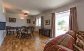 Doors lead out from the sitting-area to the verandah. - Thumbnail Image