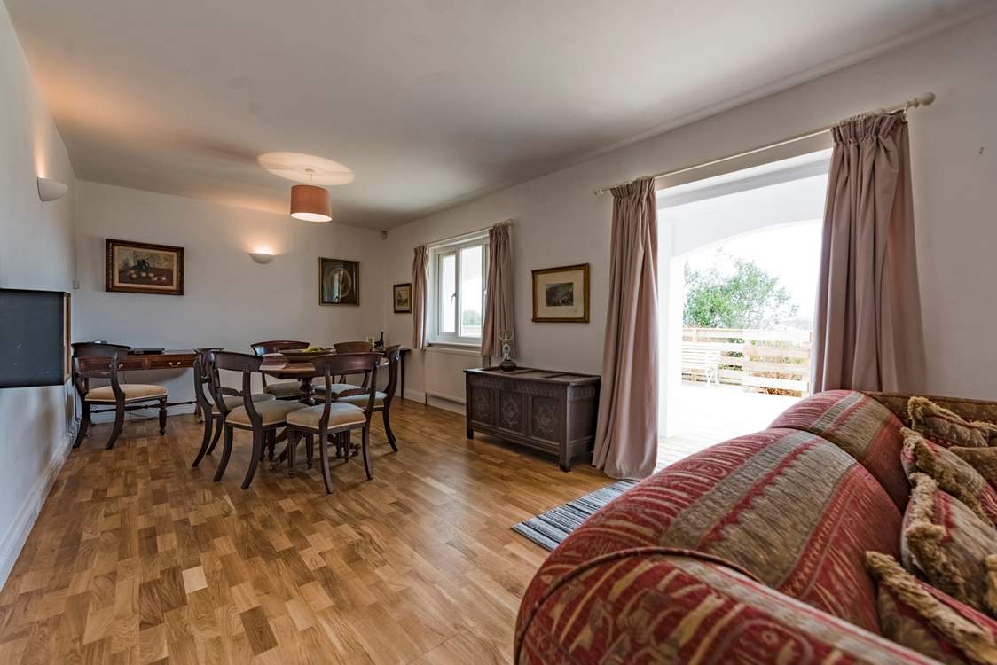 Doors lead out from the sitting-area to the verandah.