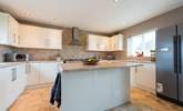 The kitchen boasts an island. - Thumbnail Image