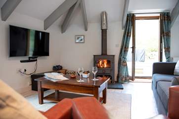 The open plan living-area has doors leading out to the huge enclosed garden.