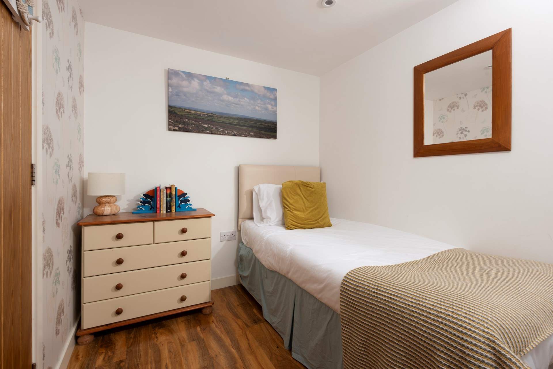 Plenty of space for 2 in this snug bedroom.
