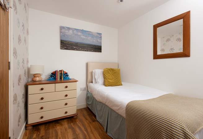 Plenty of space for two in this snug bedroom.