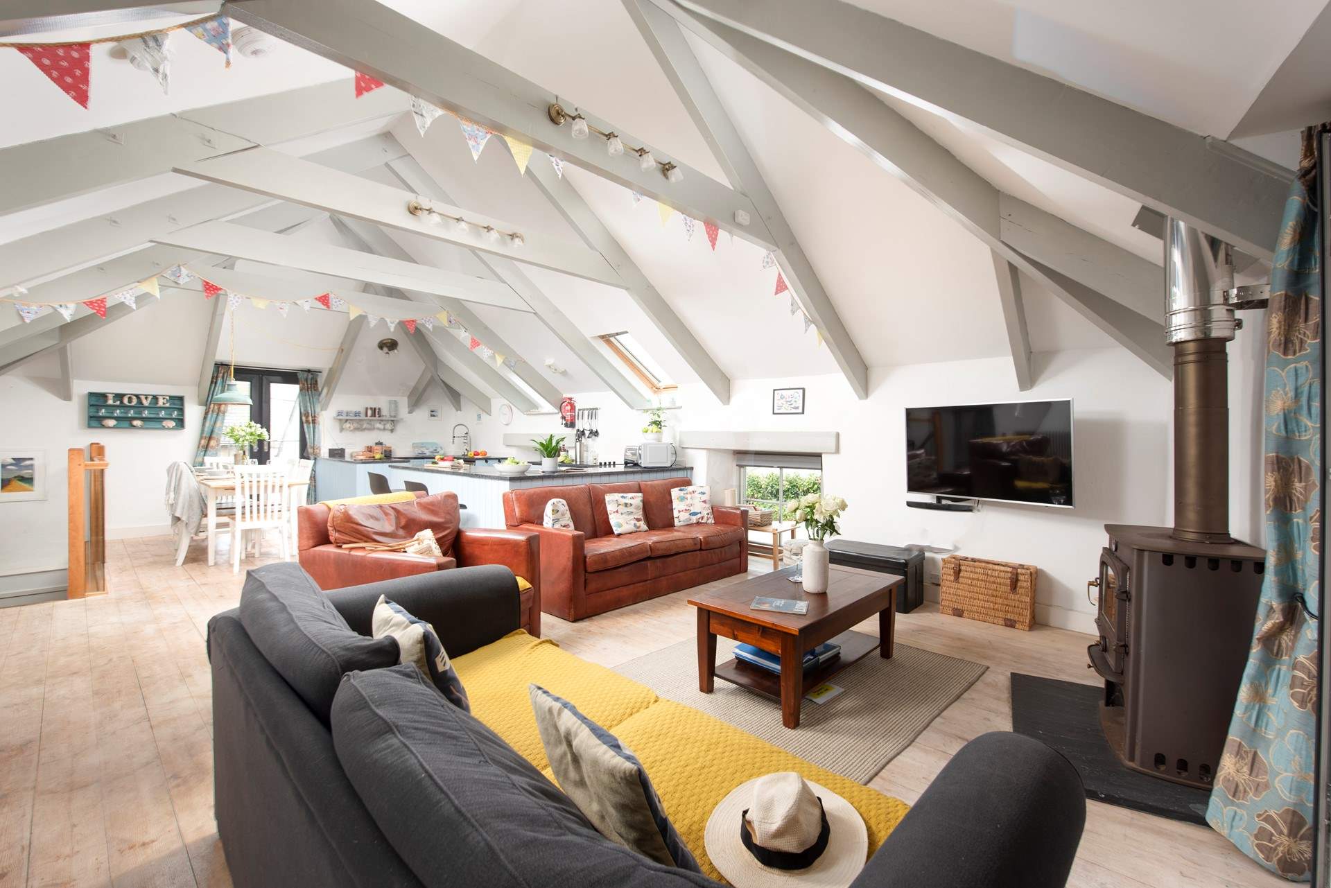 A space to sit back and relax, the stairs lead down to the 3 bedrooms.