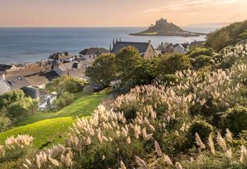 Welcome to The Old School Room with sea views from the enclosed garden, plenty of room to play and for your four legged friend to run. The cottage is the white property nestled within its lush garden.