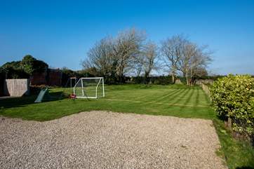The spacious garden has a children's play area too.