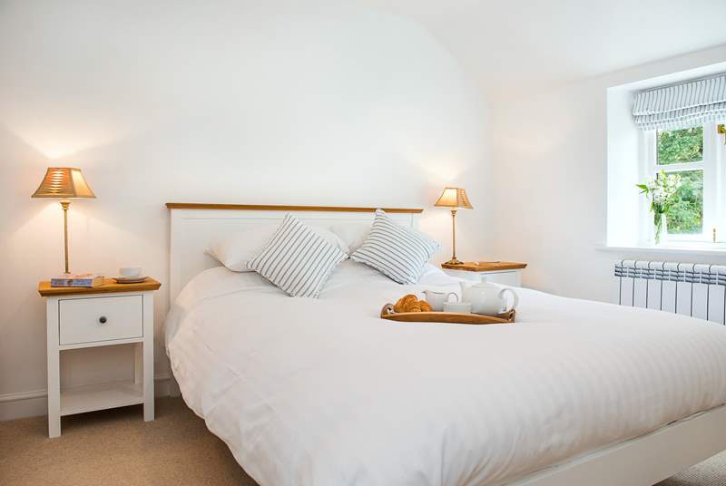 All three bedrooms are light and airy with crisp white linen on the beds.