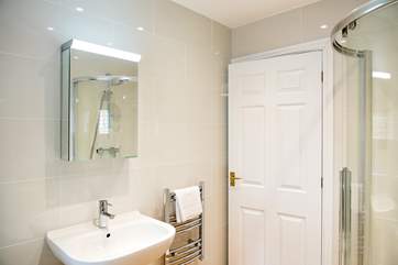 The bathroom has a bath and separate shower cubicle.