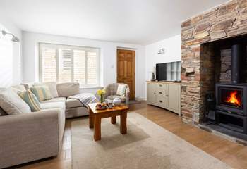 Kick back and relax on the sofa in front of the wood burner on the ground floor. 
